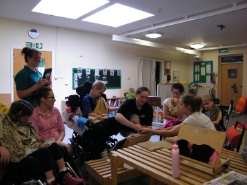 Figure 4 Children of mixed abilities participating in our workshop at the PACE Centre using feet to